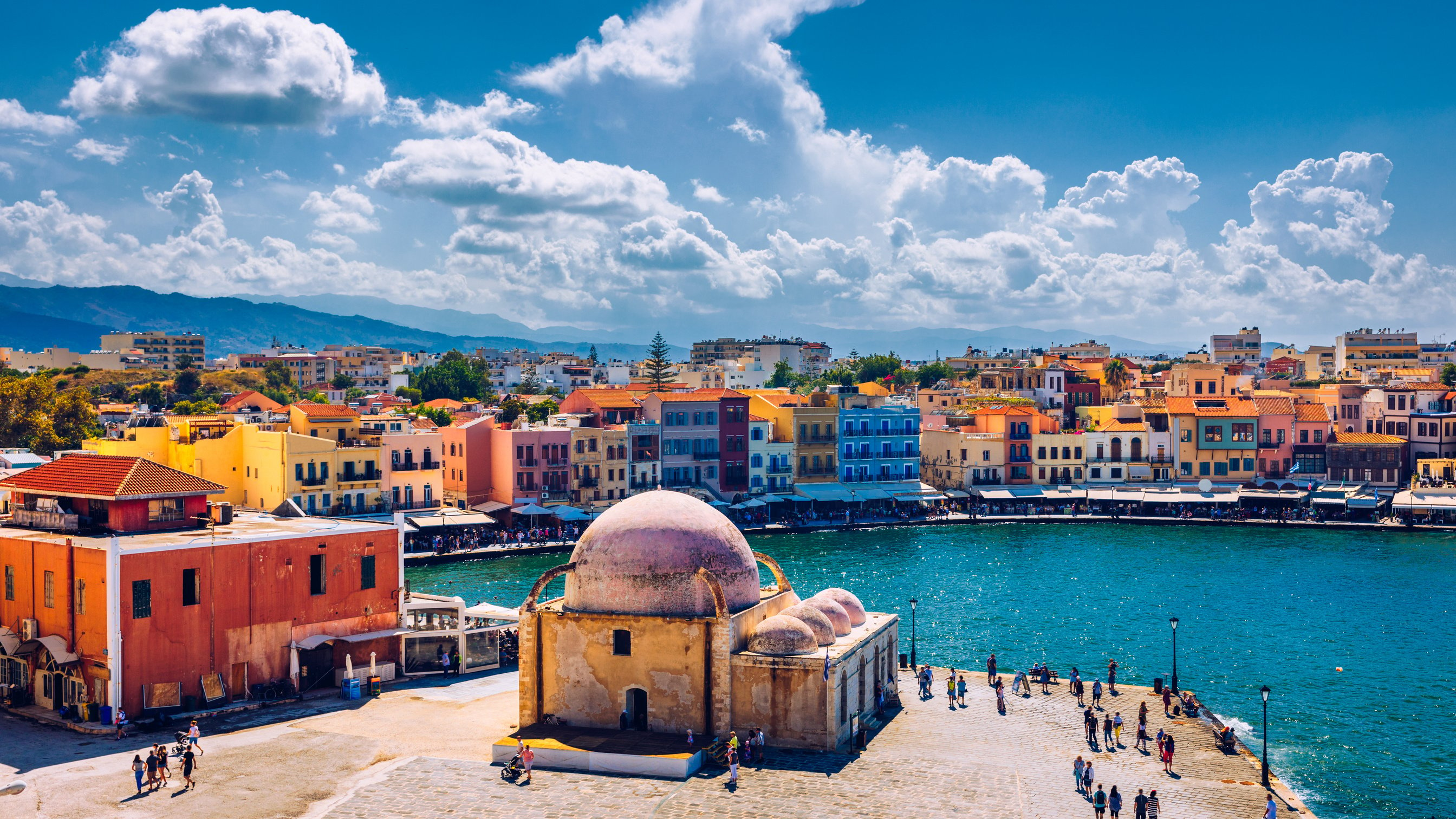 Mosque in the old Venetian harbor of Chania town on Crete island, Greece. Old mosque in Chania. Janissaries or Kioutsouk Hassan Mosque in Chania Crete. Turkish mosque in Chania bay. Crete, Greece.